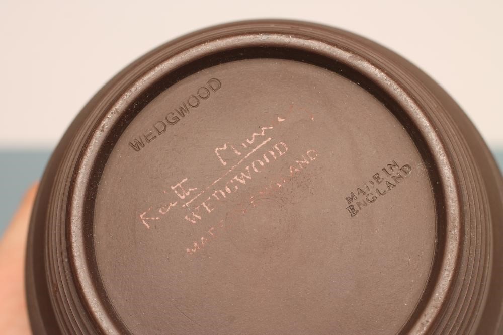 KEITH MURRAY FOR WEDGWOOD - A dark brown basalt barrel vase with five engine turned ribbed bands Image