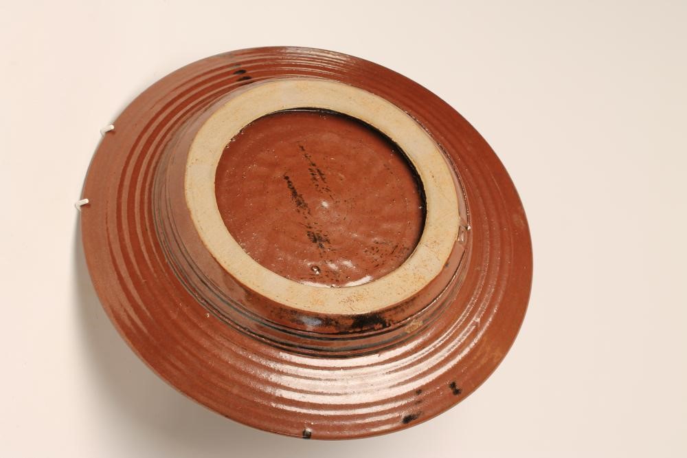 MICHAEL COLE (Contemporary) -  A studio stoneware tenmoko glazed charger of plain ribbed circular Image