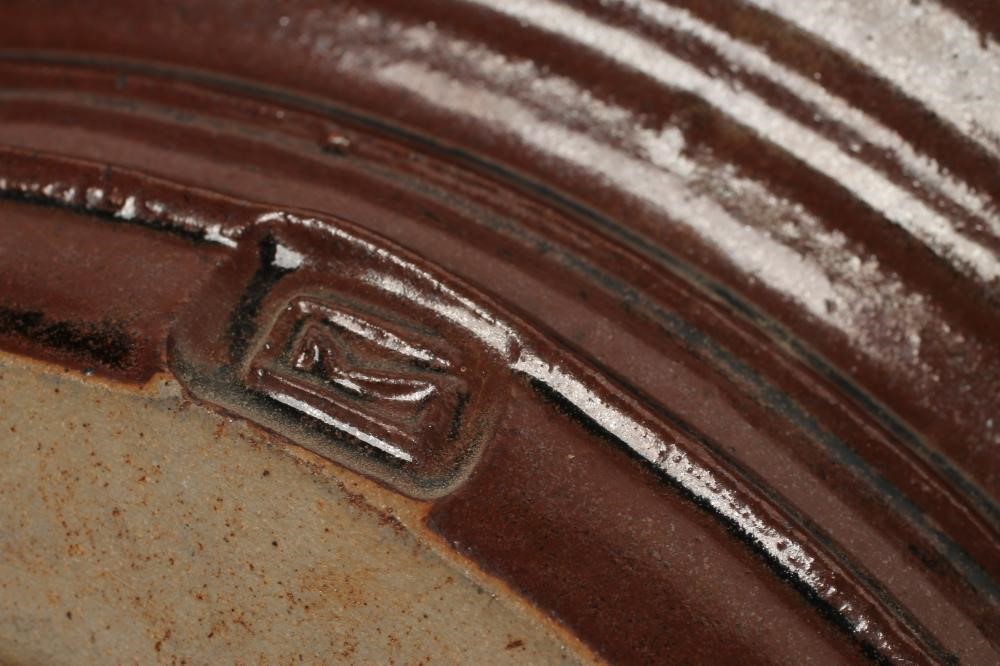MICHAEL COLE (Contemporary) -  A studio stoneware tenmoko glazed charger of plain ribbed circular Image