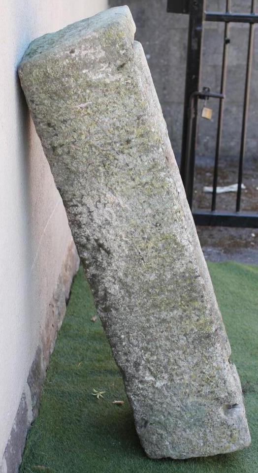 A LARGE GRANITE TROUGH of rough hewn narrow oblong form with mildly tapering sides Image