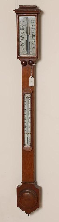 AN OAK CASED STICK BAROMETER by C. Baker Image