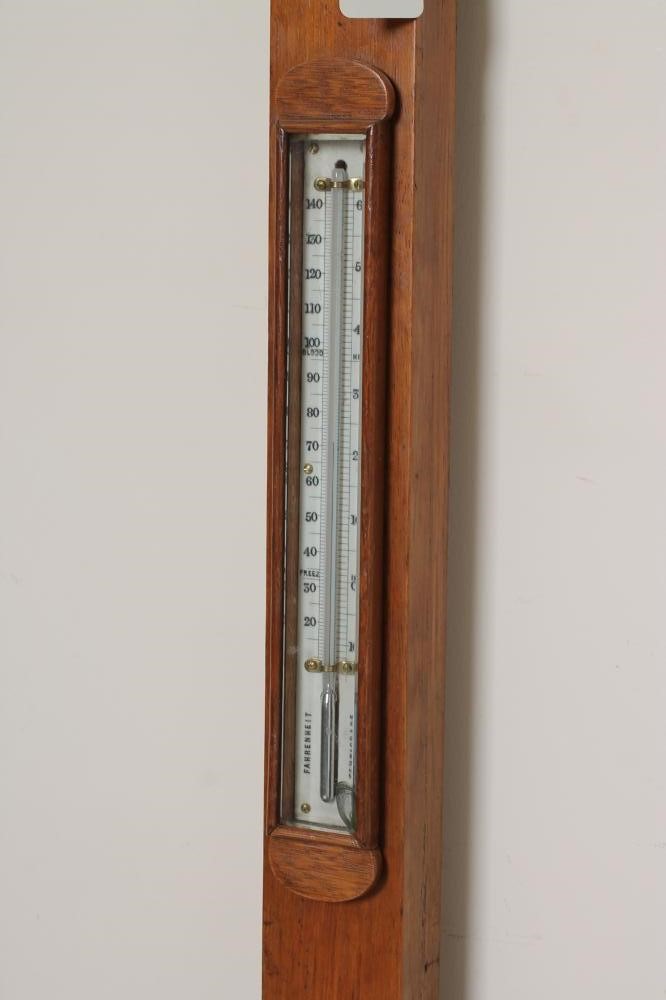 AN OAK CASED STICK BAROMETER by C. Baker Image