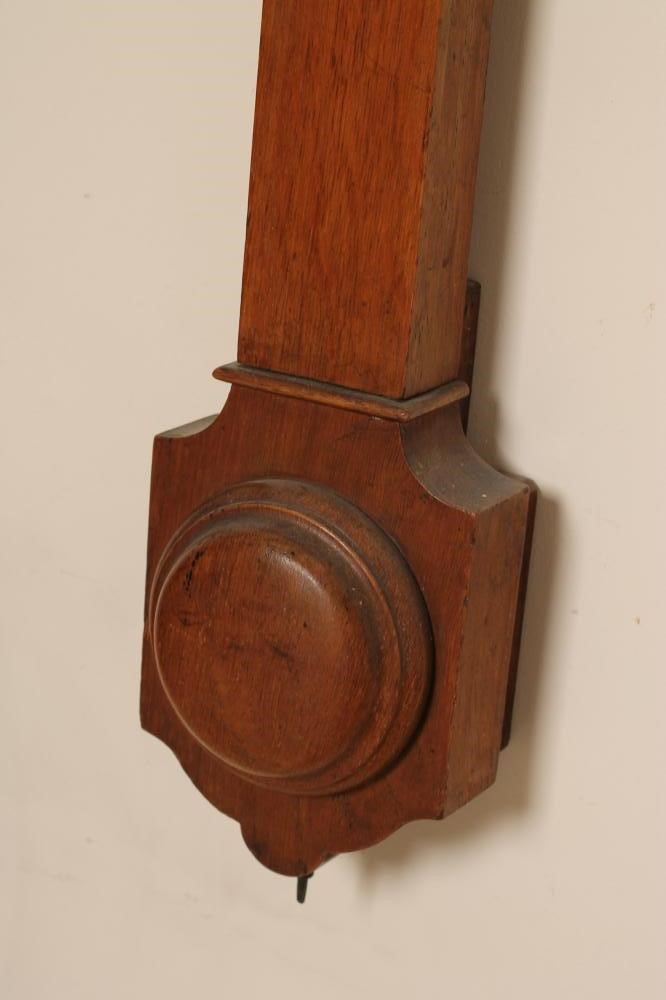 AN OAK CASED STICK BAROMETER by C. Baker Image