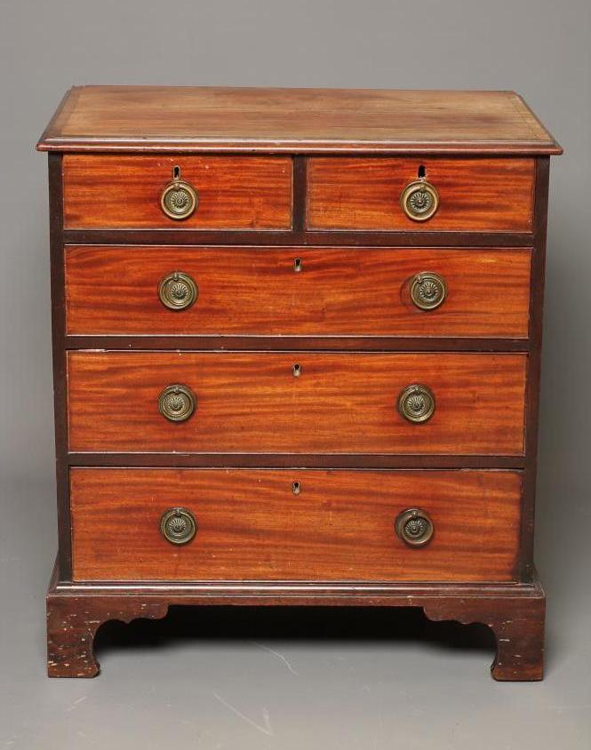 A MAHOGANY AND BANDED CHEST of two short and three long drawers Image