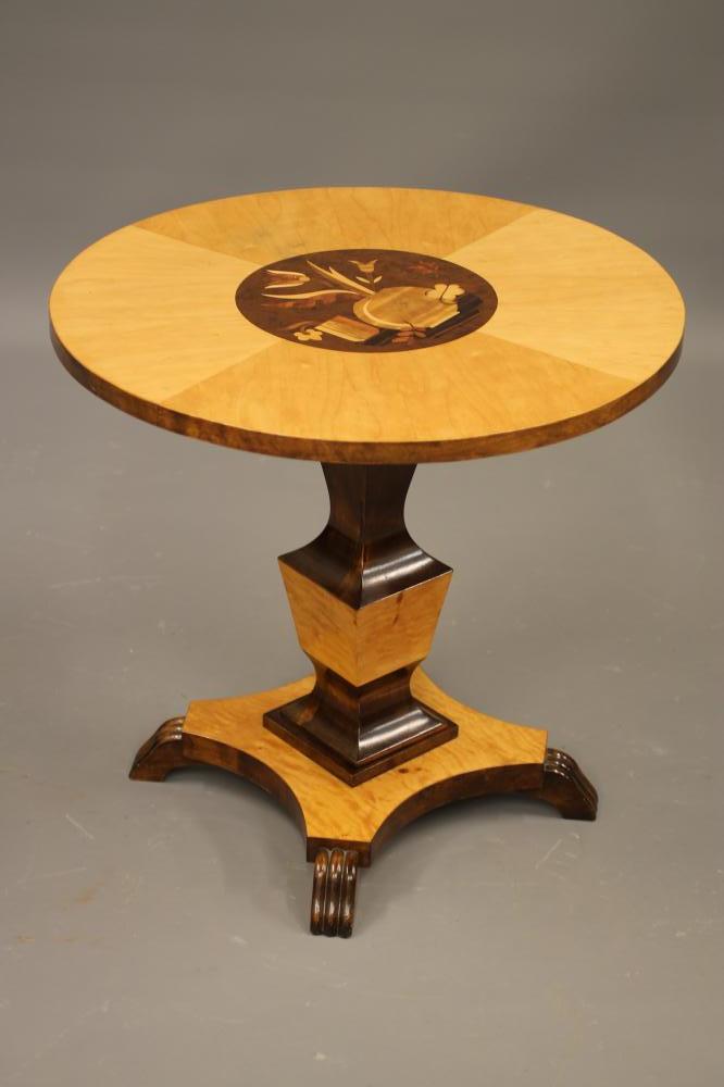 AN ART DECO STYLE OCCASIONAL TABLE veneered in various blond and dark woods Image