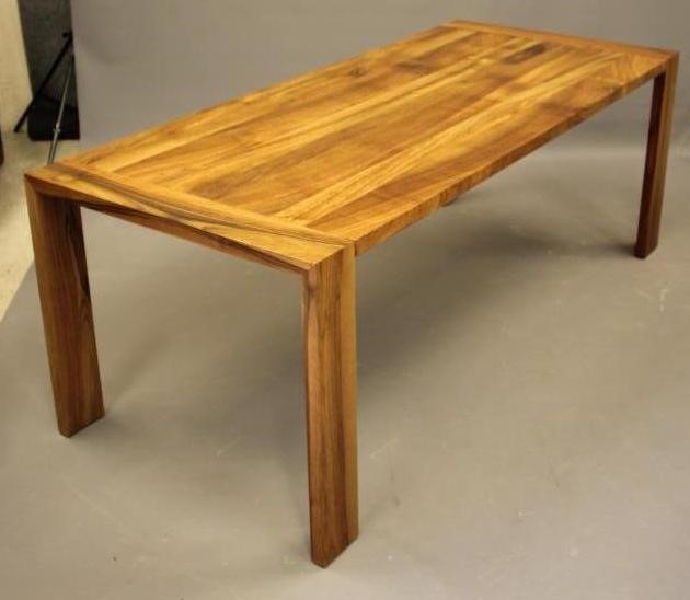A WALNUT EXTENDING TABLE by Heals of London Image