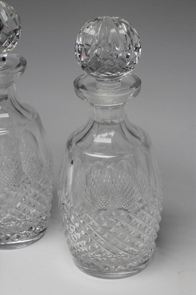A WATERFORD GLASS COLLEEN PATTERN PART TABLE SUITE comprising a pair of decanters and stoppers Image