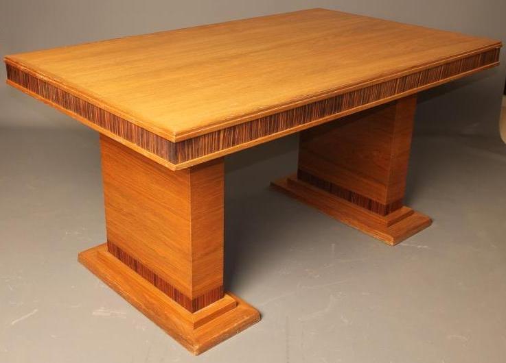 AN ART DECO DINING TABLE veneered in American white ash and with zebra wood banding Image