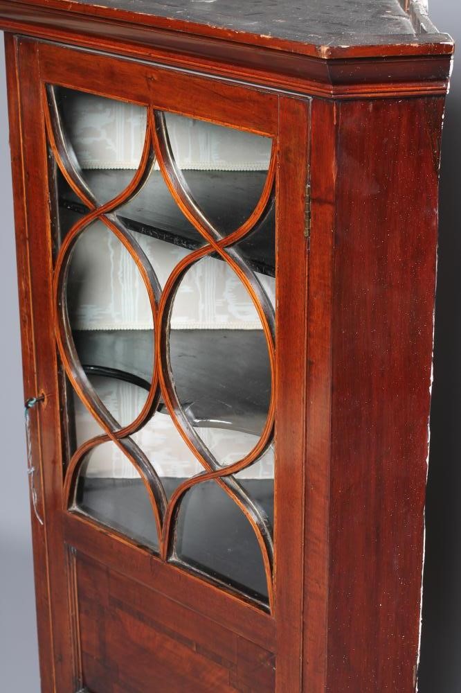A LATE GEORGIAN MAHOGANY CORNER CUPBOARD Image
