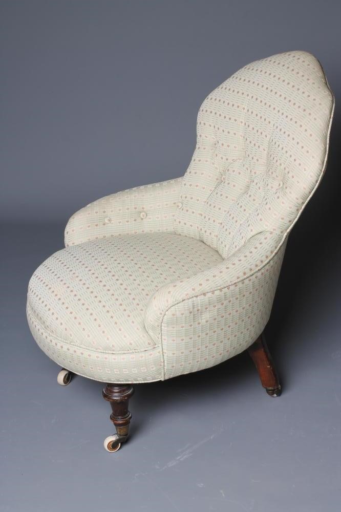 A PAIR OF VICTORIAN WALNUT FRAMED NURSING CHAIRS button upholstered in a pale green weave Image