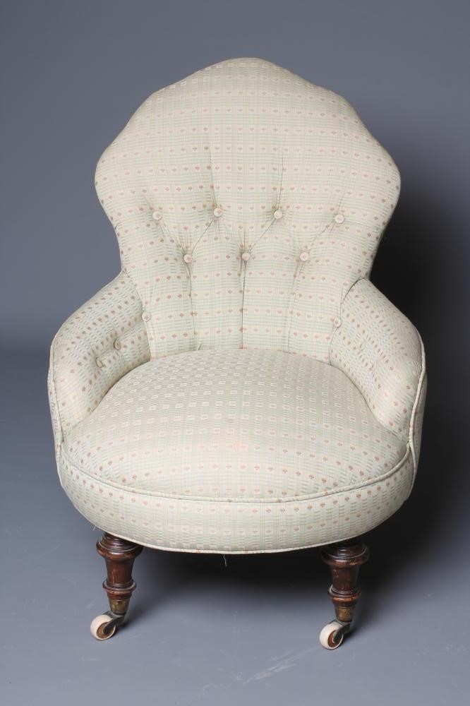 A PAIR OF VICTORIAN WALNUT FRAMED NURSING CHAIRS button upholstered in a pale green weave Image