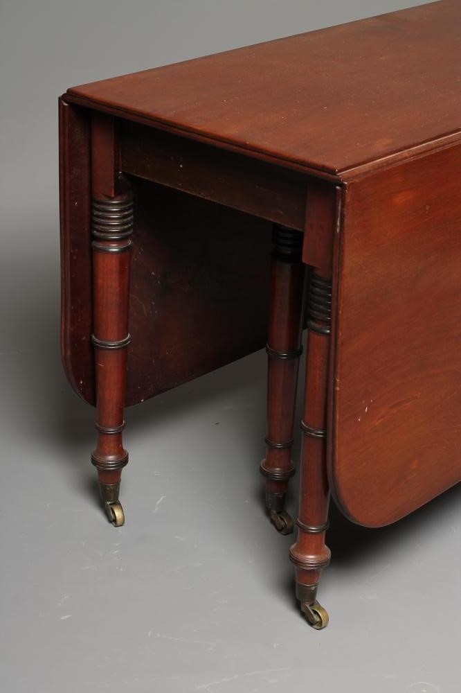 A REGENCY MAHOGANY DROP LEAF DINING TABLE Image