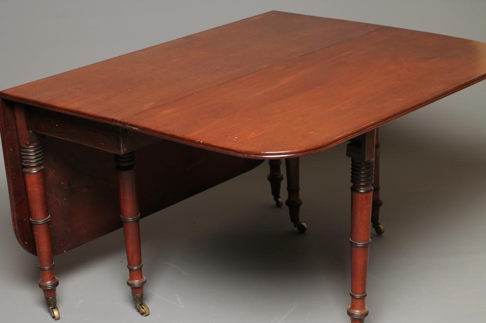A REGENCY MAHOGANY DROP LEAF DINING TABLE Image