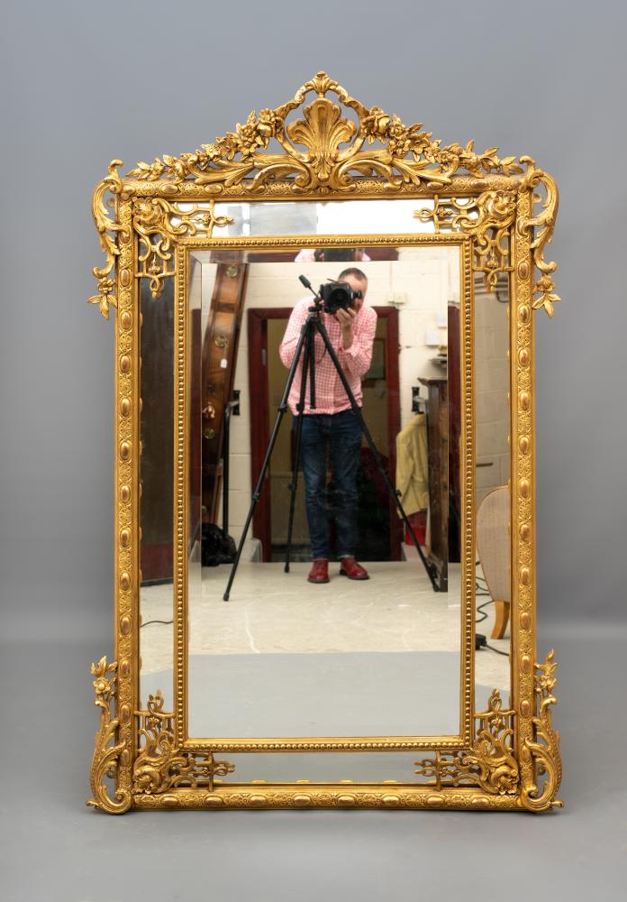 A VICTORIAN GILT GESSO PIER GLASS of oblong form with chamfered bevelled plate surround Image