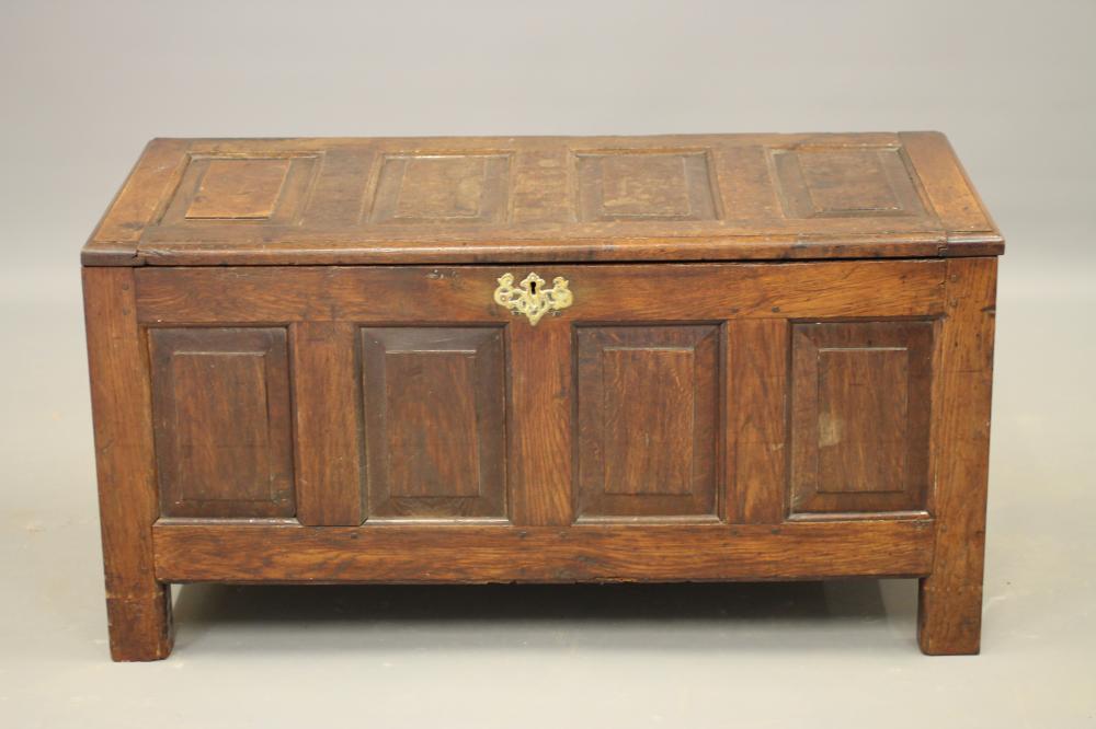 AN OAK PANELLED COFFER Image