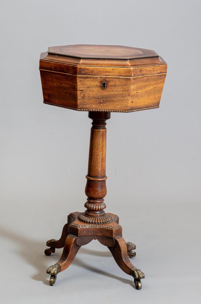 A REGENCY MAHOGANY TEAPOY of octagonal form with ebony stringing and beaded edging Image
