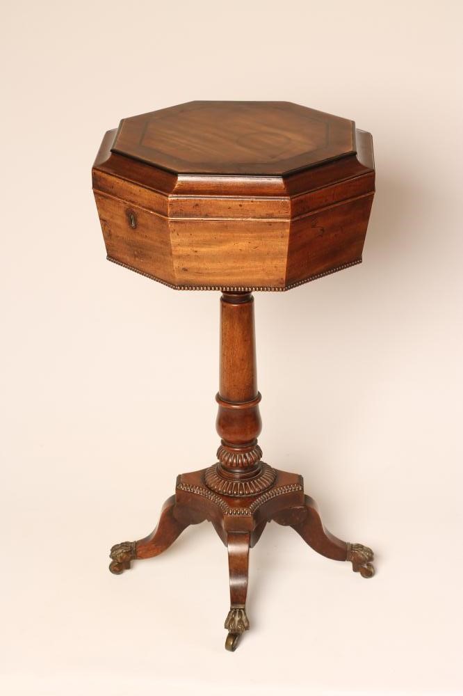 A REGENCY MAHOGANY TEAPOY of octagonal form with ebony stringing and beaded edging Image