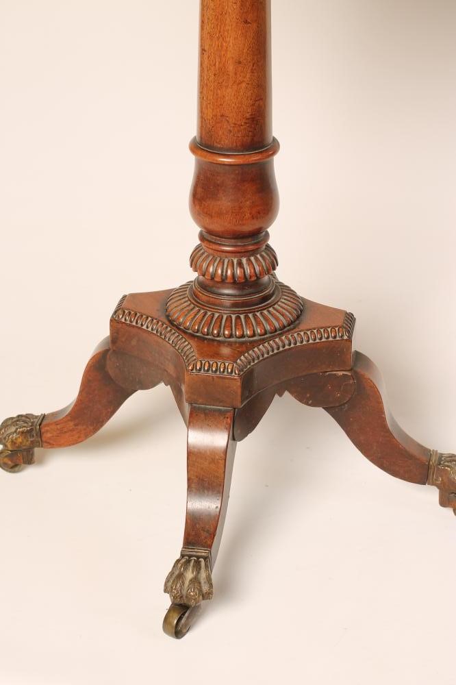 A REGENCY MAHOGANY TEAPOY of octagonal form with ebony stringing and beaded edging Image