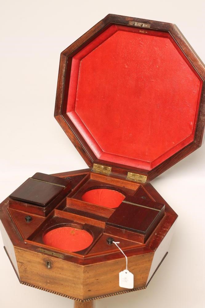 A REGENCY MAHOGANY TEAPOY of octagonal form with ebony stringing and beaded edging Image
