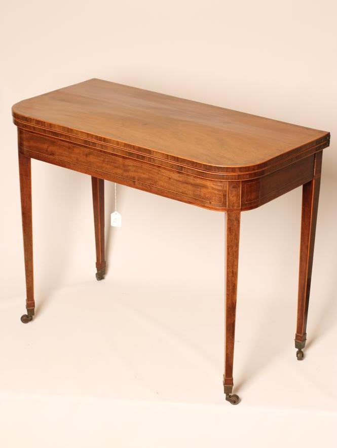A GEORGIAN MAHOGANY FOLDING TEA TABLE Image
