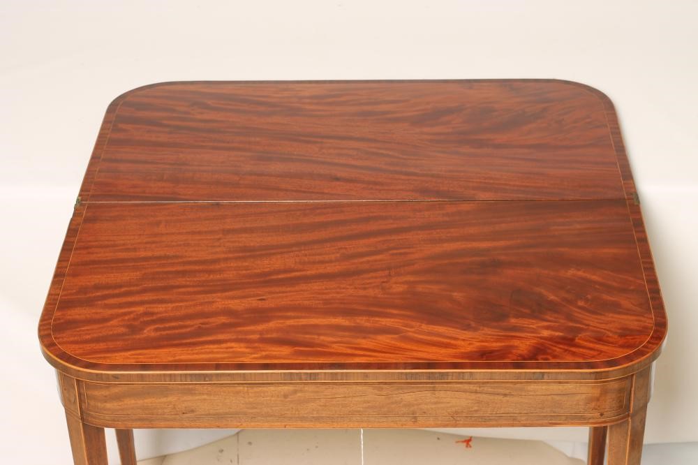 A GEORGIAN MAHOGANY FOLDING TEA TABLE Image