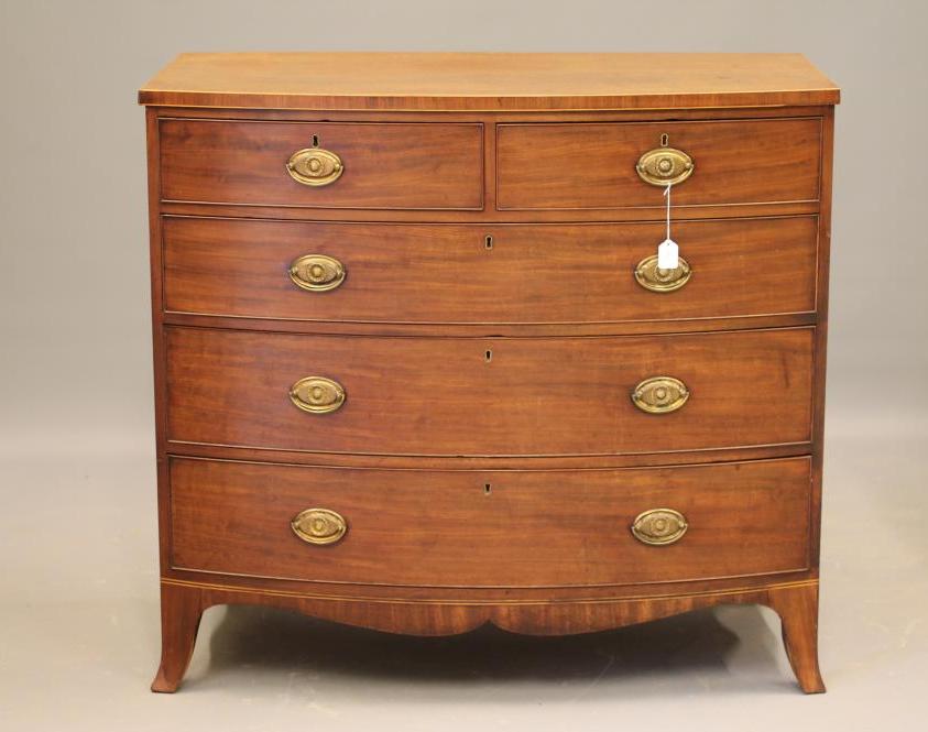 A REGENCY MAHOGANY CHEST of bowed form Image