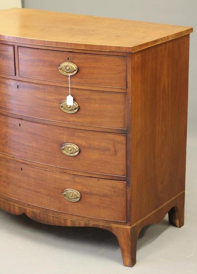 A REGENCY MAHOGANY CHEST of bowed form Image
