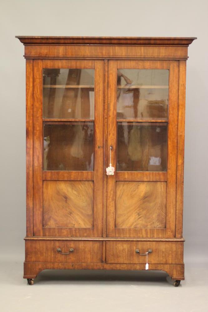 A CONTINENTAL MAHOGANY BOOKCASE Image