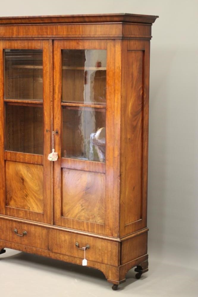 A CONTINENTAL MAHOGANY BOOKCASE Image