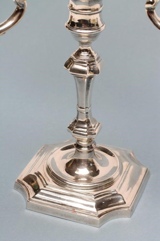 A GEORGE I STYLE SILVER THREE BRANCH CANDELABRUM Image