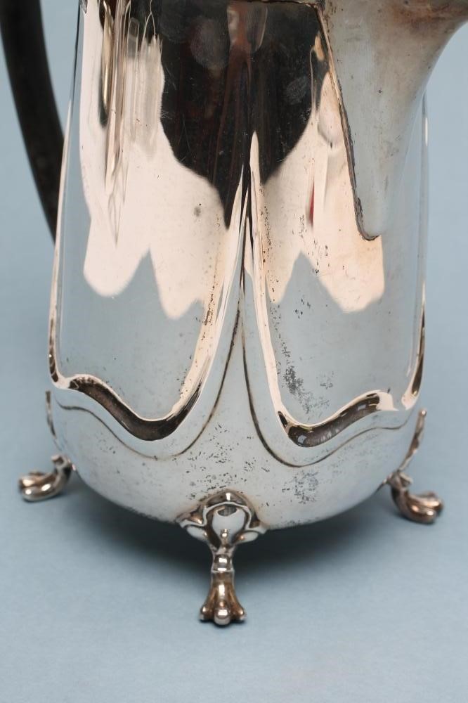 AN ART NOUVEAU SILVER HOT WATER JUG Image