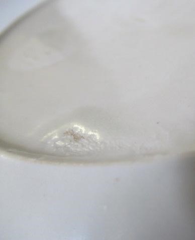 A CHINESE WHITE GLAZED PORCELAIN DISH of fluted circular form centrally carved with a crane in Image