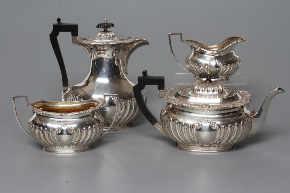 AN EDWARDIAN SILVER FOUR PIECE TEA AND COFFEE SERVICE Image