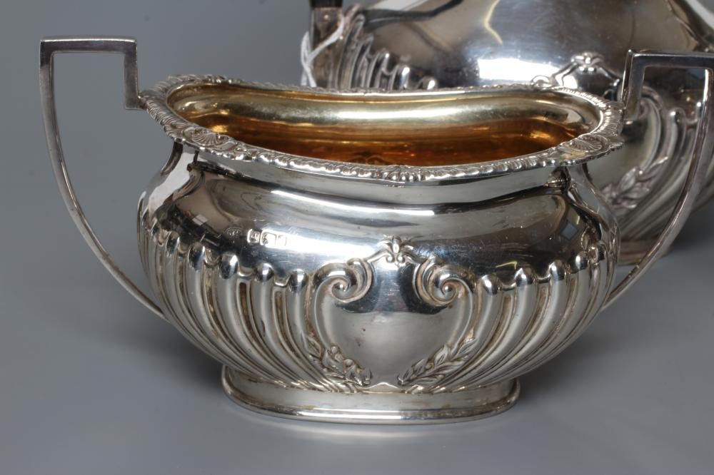 AN EDWARDIAN SILVER FOUR PIECE TEA AND COFFEE SERVICE Image