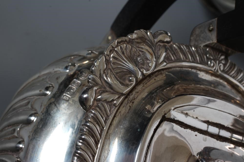 AN EDWARDIAN SILVER FOUR PIECE TEA AND COFFEE SERVICE Image