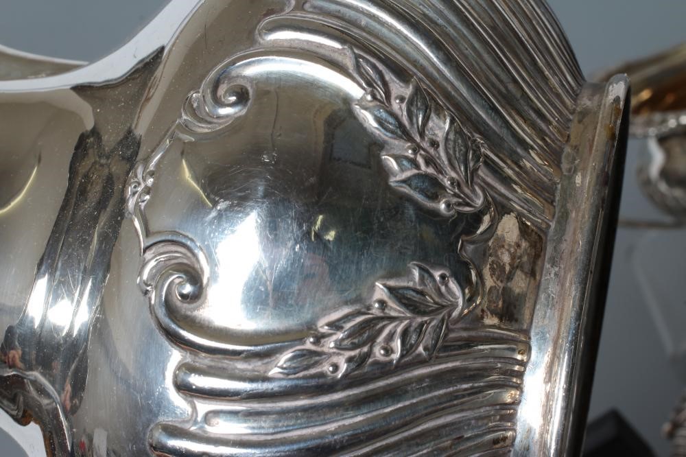 AN EDWARDIAN SILVER FOUR PIECE TEA AND COFFEE SERVICE Image