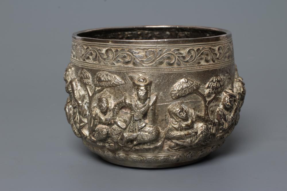 A BURMESE WHITE METAL BOWL of rounded cylindrical form Image