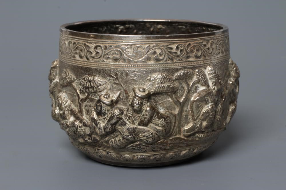 A BURMESE WHITE METAL BOWL of rounded cylindrical form Image