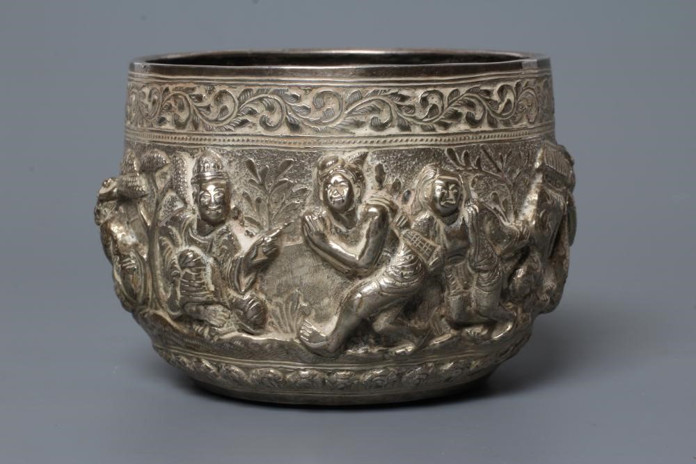 A BURMESE WHITE METAL BOWL of rounded cylindrical form Image