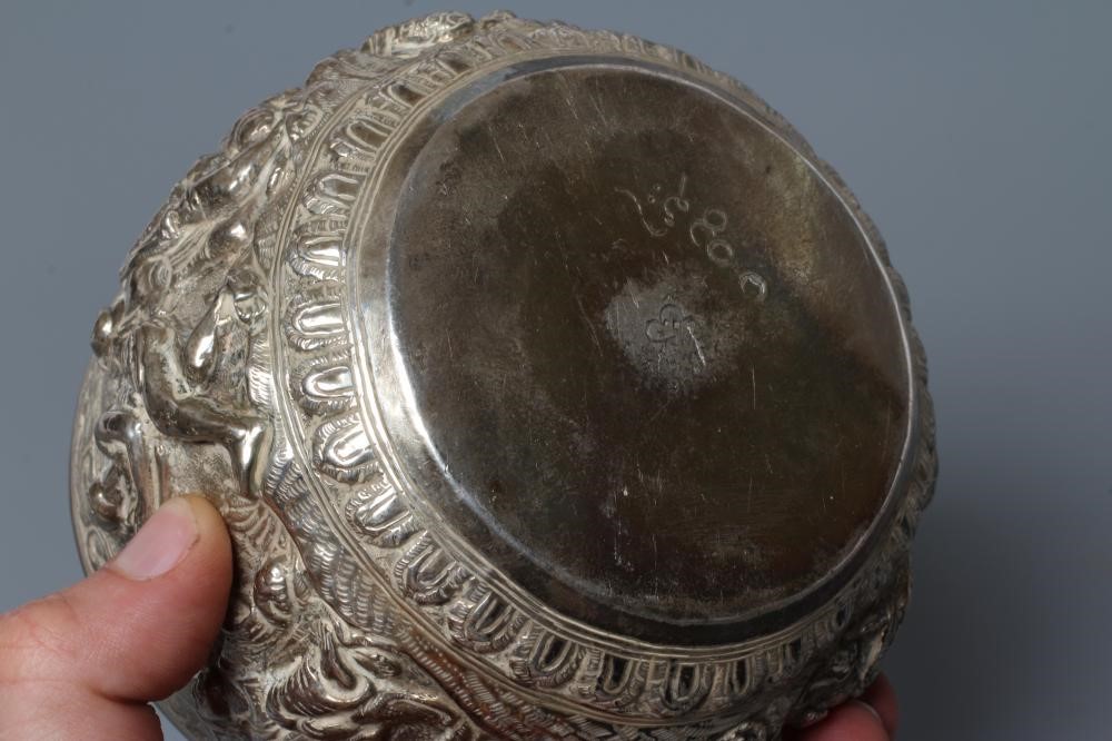 A BURMESE WHITE METAL BOWL of rounded cylindrical form Image