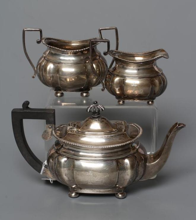 A LATE VICTORIAN THREE PIECE BACHELOR'S SILVER TEA SERVICE Image