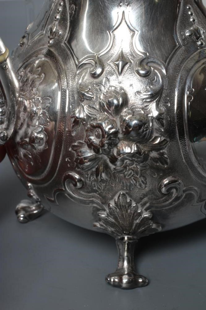 A MID VICTORIAN SILVER FOUR PIECE TEA AND COFFEE SERVICE Image