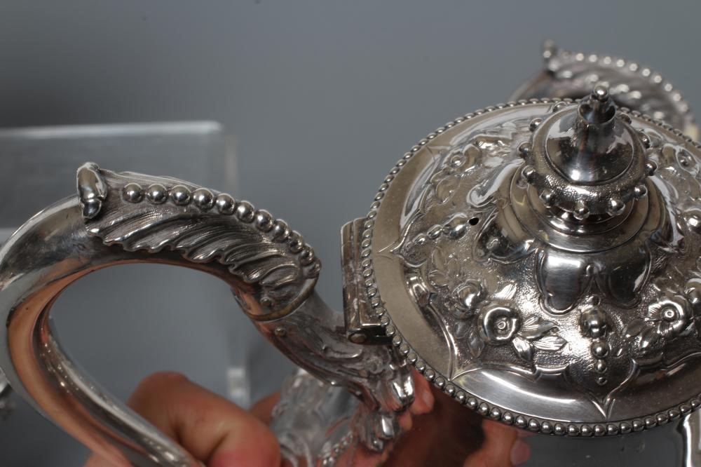 A MID VICTORIAN SILVER FOUR PIECE TEA AND COFFEE SERVICE Image