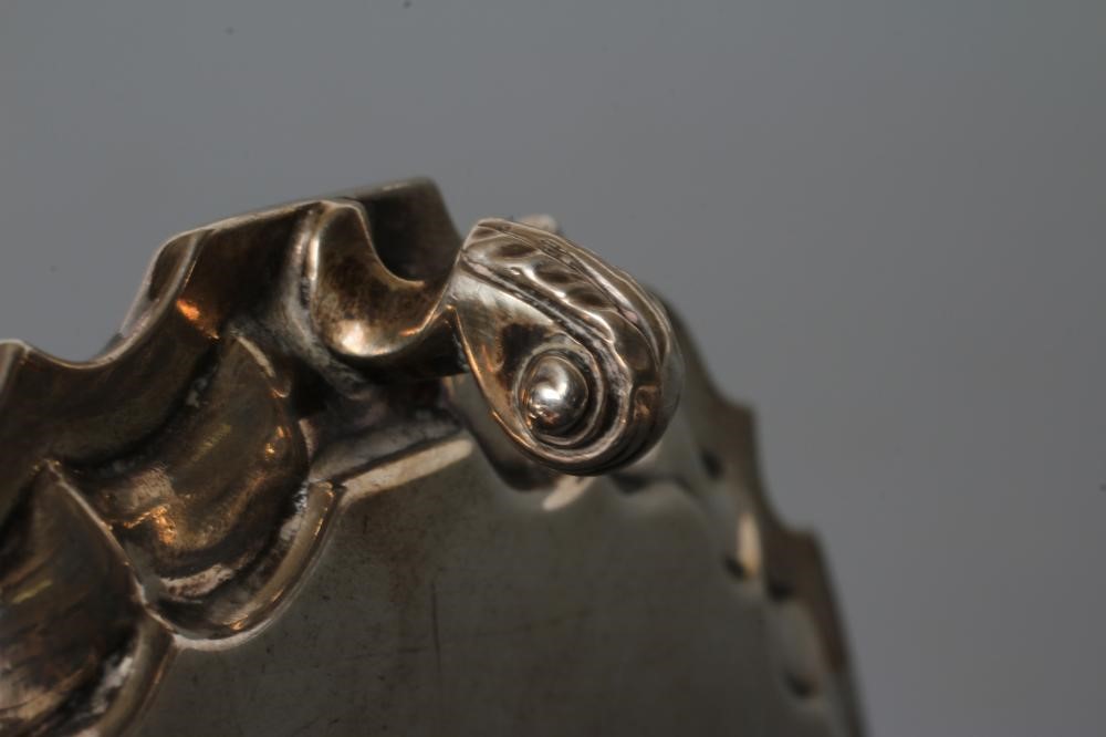 A LATE VICTORIAN SILVER WAITER Image