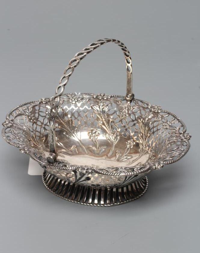 A GEORGE III SILVER EPERGNE BASKET Image