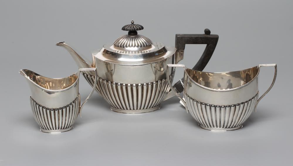 AN EDWARDIAN SILVER THREE PIECE TEA SERVICE Image