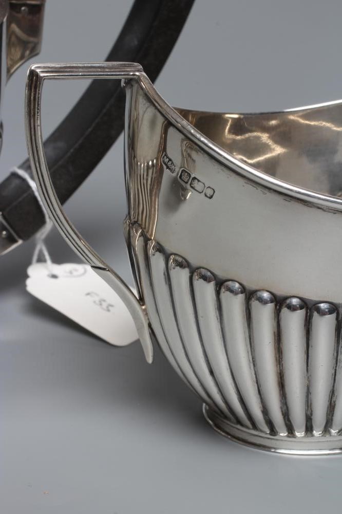 AN EDWARDIAN SILVER THREE PIECE TEA SERVICE Image