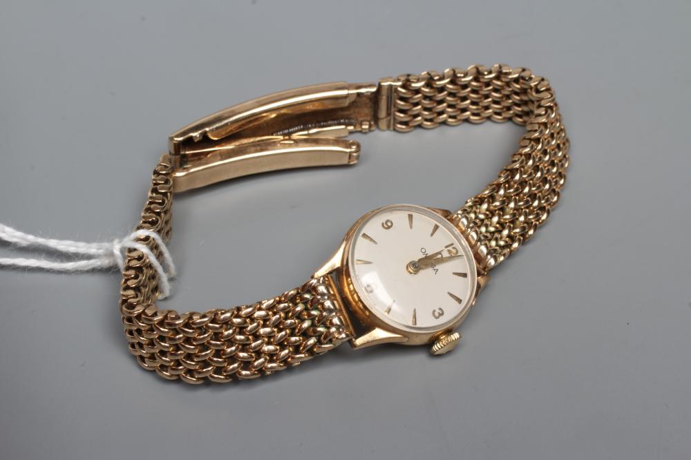 A LADY'S 9CT GOLD OMEGA WRISTWATCH Image