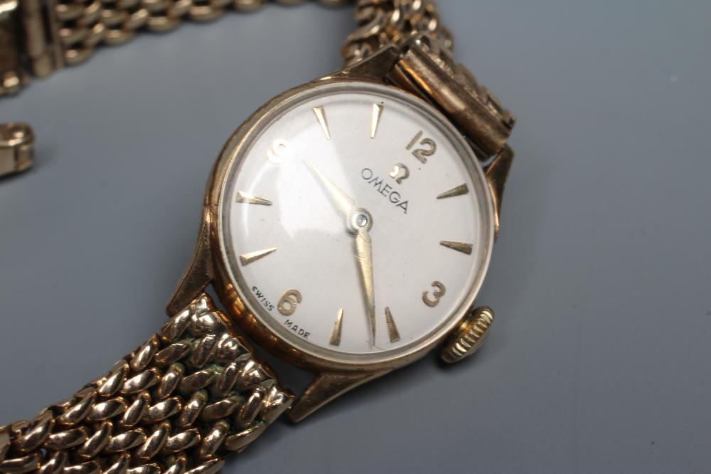 A LADY'S 9CT GOLD OMEGA WRISTWATCH Image