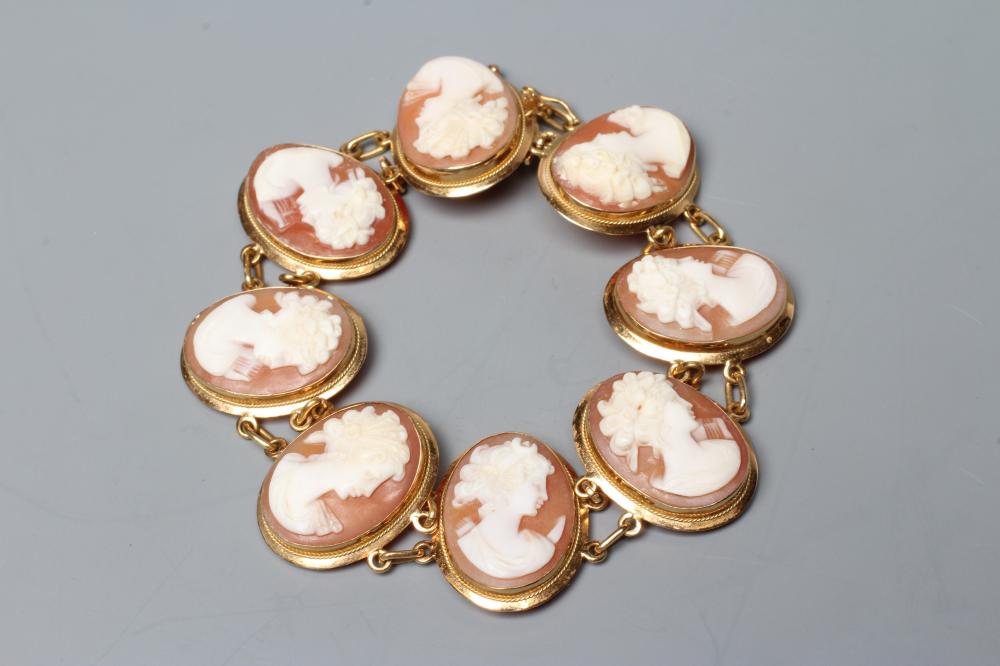 A SHELL CAMEO BRACELET, the eight oval panels carved with the head portrait of a young lady, in Image